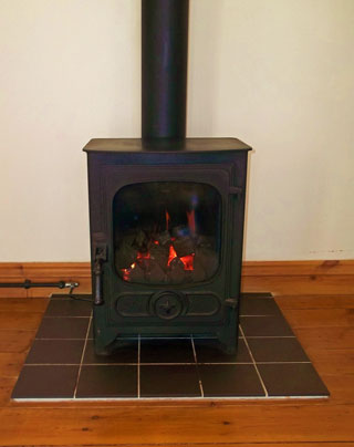 he gas fired woodburner provides a cosy ambience